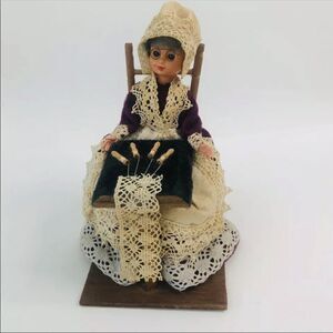 vintage old lady sitting in chair making lace handmade granny grandma kitschy